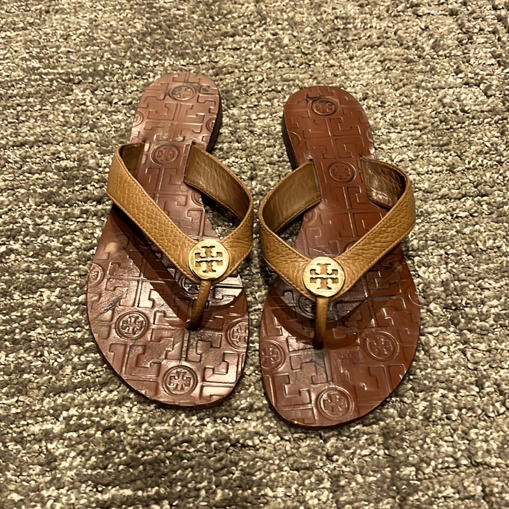 Tory Burch royal tan/gold Thor’s flip flops